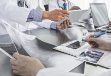 Doctor looking at X-ray photo